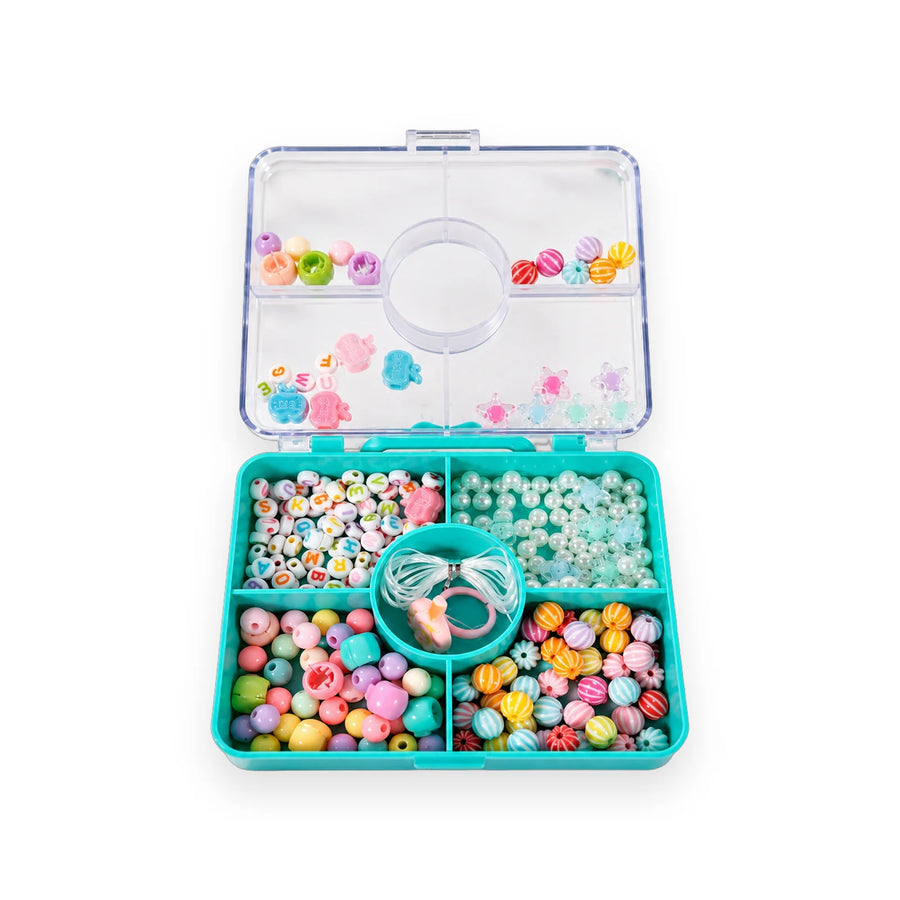 Teal bead box open, showing six trays of beads and a spool of elastic cord