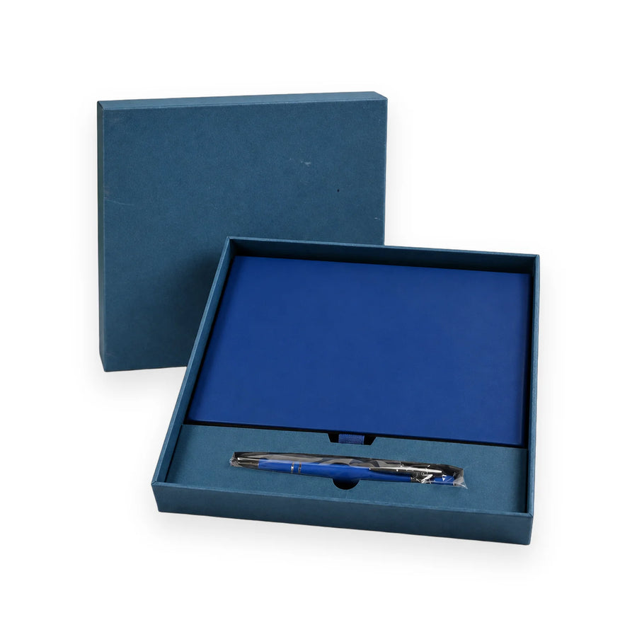 Navy gift box open to show a navy notebook and a matching metal pen