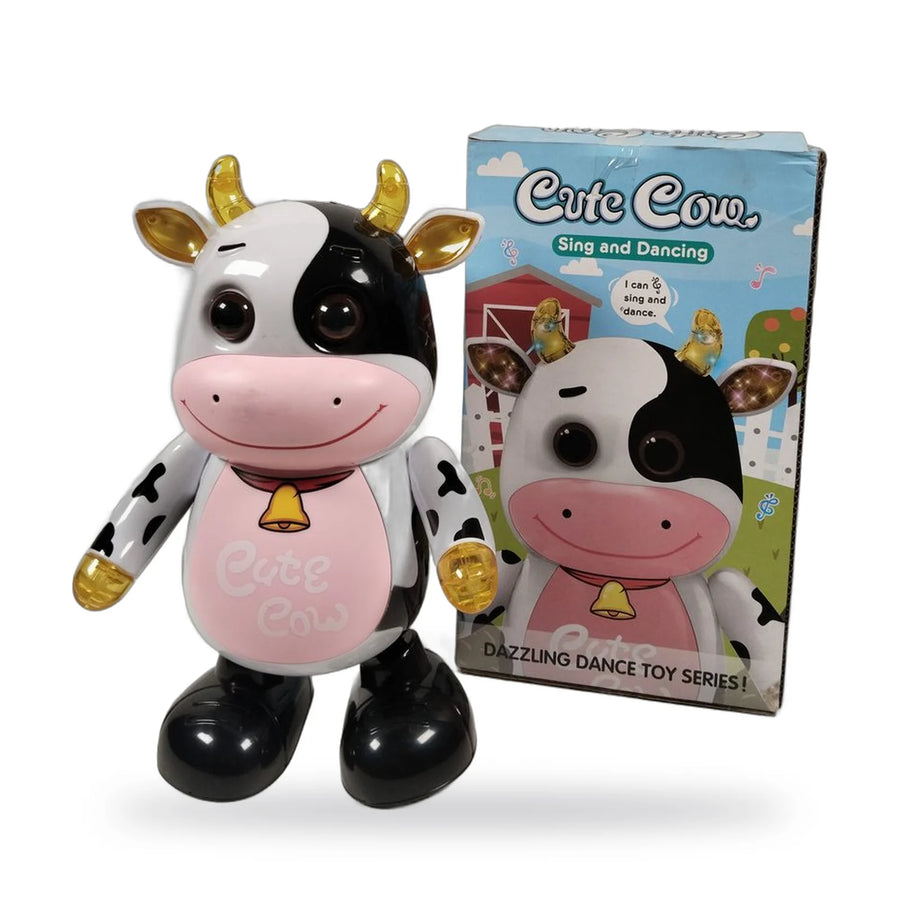 Plastic singing and dancing toy cow with black and white spots, pink belly and gold horns