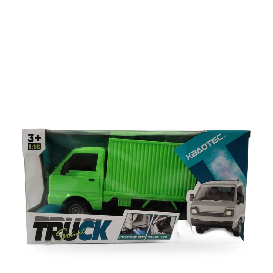 Green remote control container truck with an opening cab door and its remote