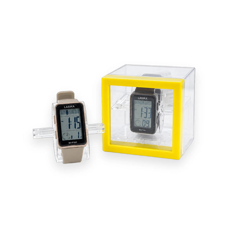 Lasika W-F181 digital watch with a slim LCD face and beige strap beside its clear display cube