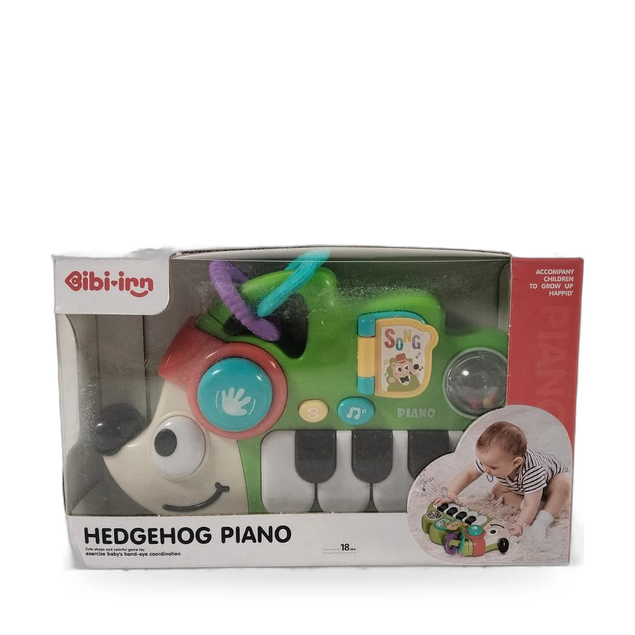 Green hedgehog-shaped baby piano toy with keys, buttons and a spinning wheel