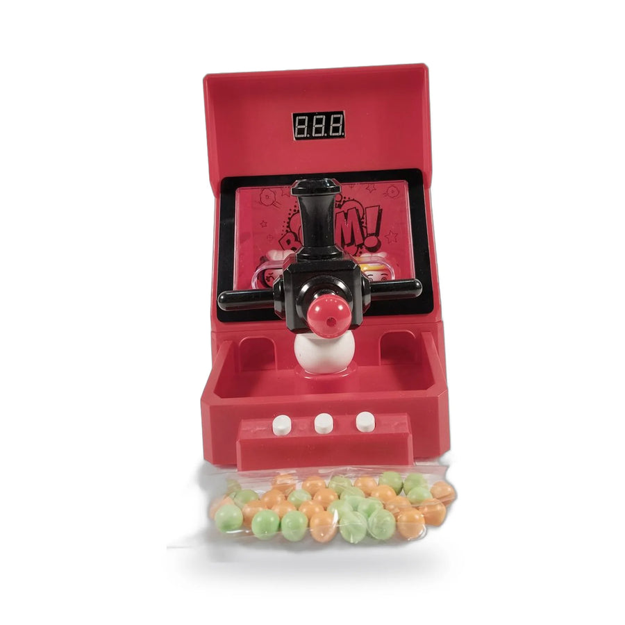Red plastic pinball game machine with marbles and a digital score display beside its packaging