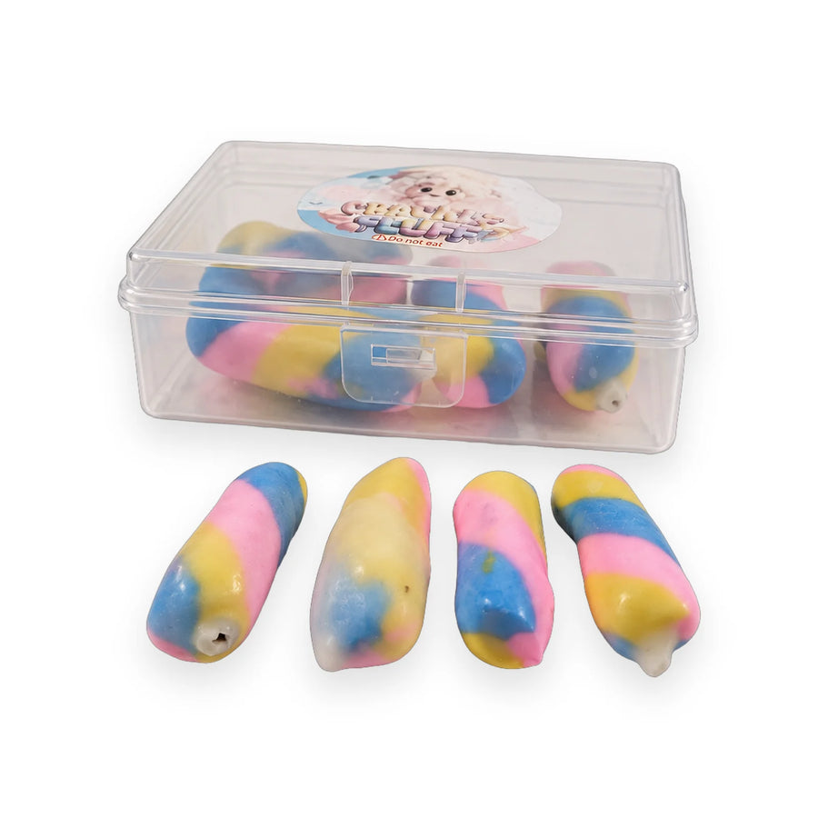 Crackle Fluff pastel squishy sticks in pink, yellow and blue beside their clear case