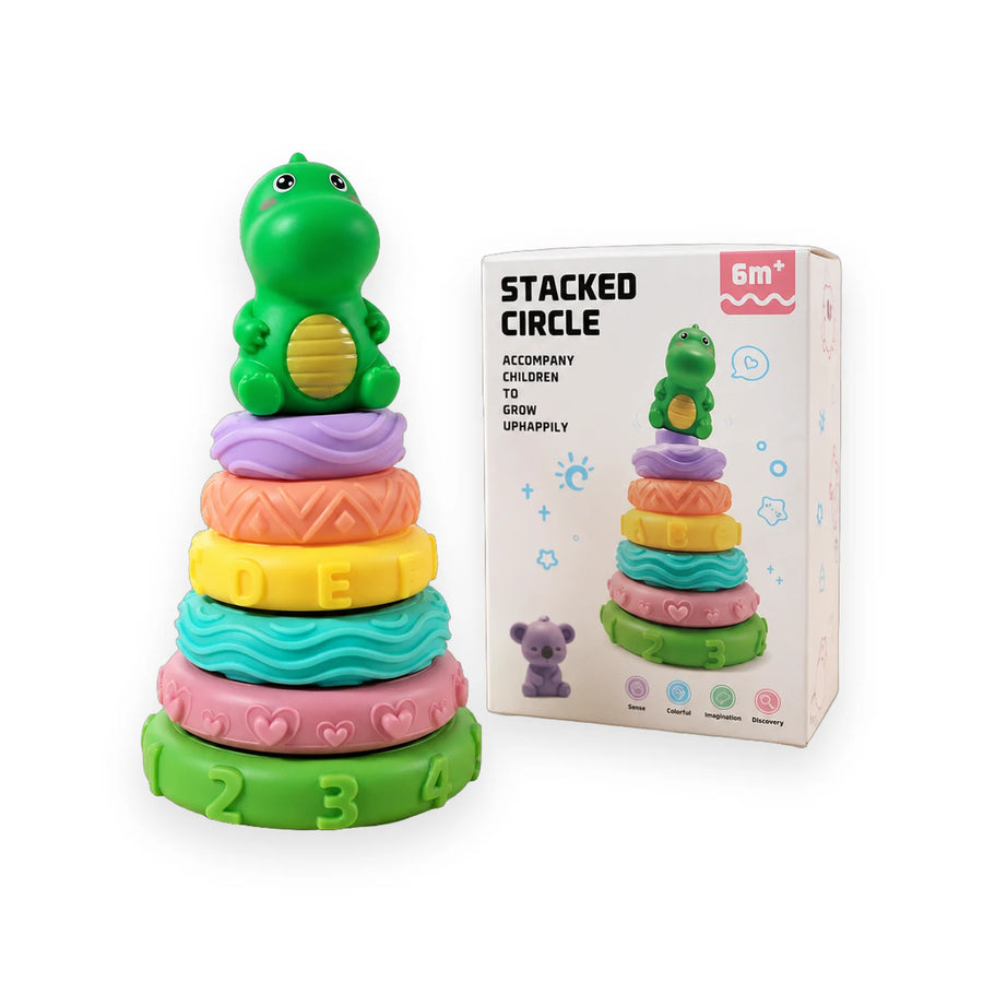 Pastel ring stacker toy with textured rings and a green dinosaur on top