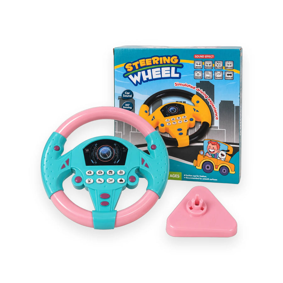 Teal and pink toy steering wheel with its suction base and box