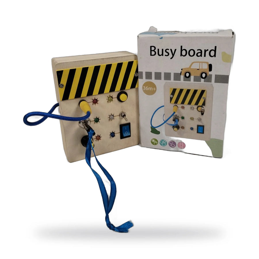 Wooden busy board with a yellow and black striped panel and a blue strap