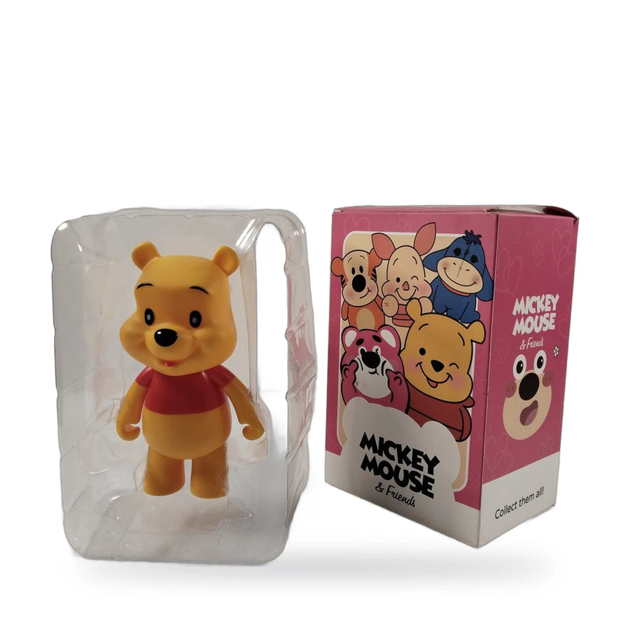 Winnie the Pooh figure in a red top inside a clear window box